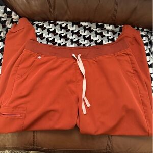 Figs Women’s Scrub Joggers in Burnt Orange with Pink Drawstring